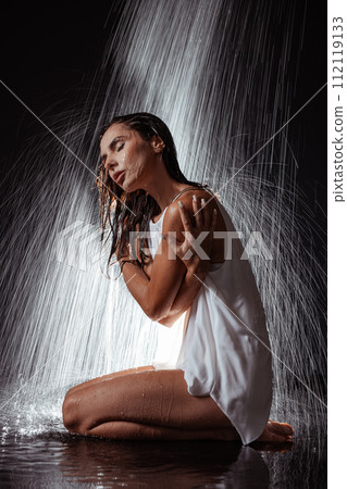 girl in the shower on a dark background, spa concept girl in the shower on a dark background, spa concept 112119133