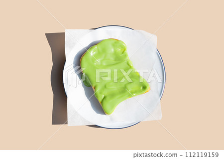 Grilled butter toast with thai pandan custard on white plate Grilled butter toast with thai pandan custard on white plate 112119159