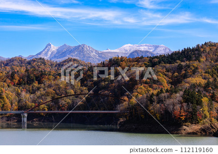 Yubari City, Hokkaido, autumn leaves at Mt. Yubari and Lake Shuparo covered in light snow [October] 112119160