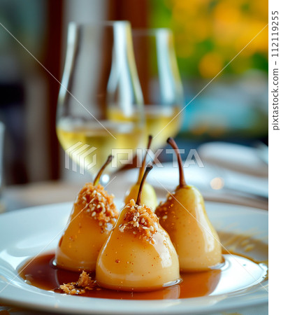 Paleo style dessert poached pear dessert pashot. Pear caramelized in syrup on a wooden plate 112119255