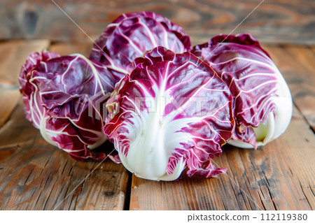 Radicchio rosso lettuce isolated on white background. Fresh green salad leaves from garden Radicchio rosso lettuce isolated on white background. Fresh green salad leaves from garden 112119380