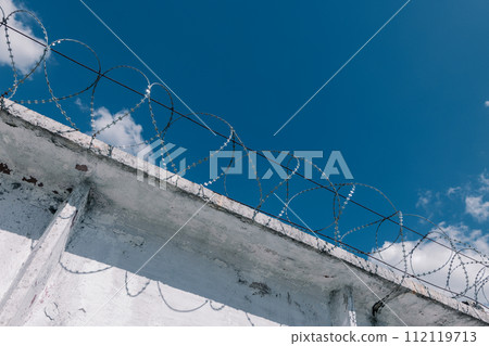 concrete prison fence, prison fence with barbed wire concrete prison fence, prison fence with barbed wire 112119713