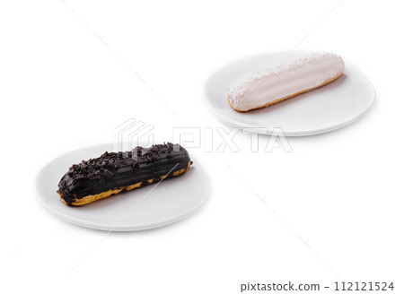 Two delicious eclairs covered with glaze Two delicious eclairs covered with glaze 112121524