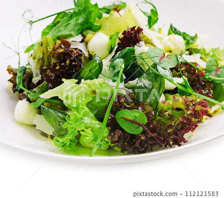 Healthy mozzarella salad on white plate Healthy mozzarella salad on white plate 112121583