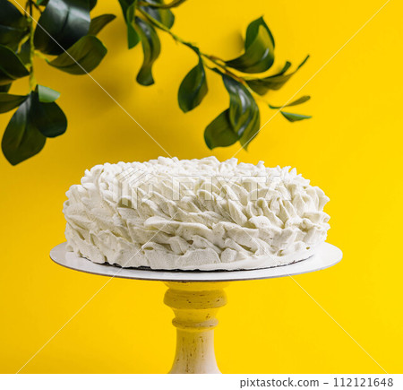 Coffee Mousse Cake on Yellow Background 112121648