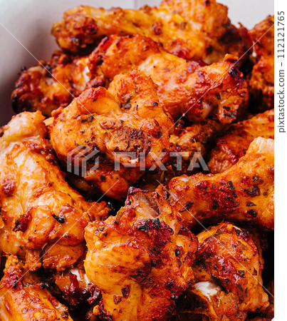 Fried chicken wings and legs in a paper box Fried chicken wings and legs in a paper box 112121765