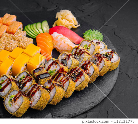 Sushi set on black stone background Sushi set on black stone background 112121773