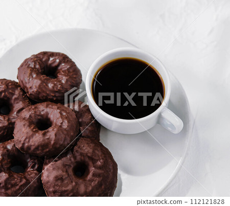 cookies in chocolate glaze with cup of coffee cookies in chocolate glaze with cup of coffee 112121828