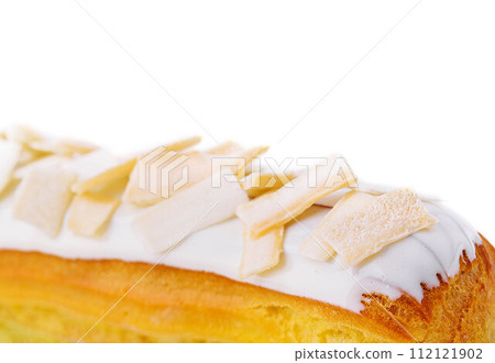 Eclair with white chocolate close up 112121902