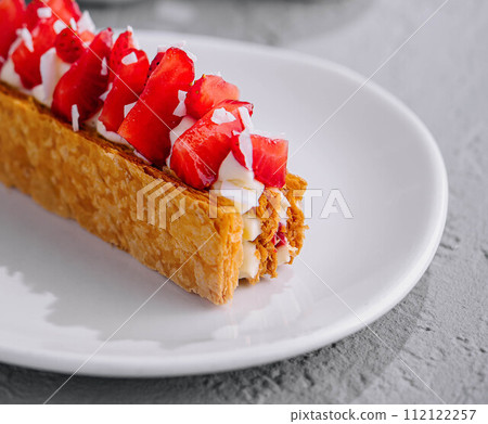 Piece of Napoleon Cake with Strawberry on plate Piece of Napoleon Cake with Strawberry on plate 112122257