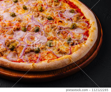 Delicious pizza Tuna with tomatoes, olives, onion and capers Delicious pizza Tuna with tomatoes, olives, onion and capers 112122285