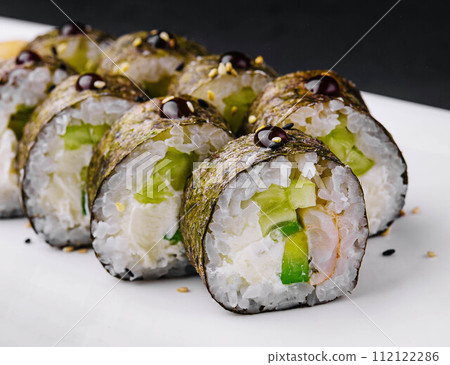 sushi maki with shrimp and cucumbers 112122286