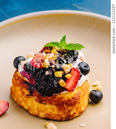 one cottage cheese pancake with jam and sour cream 112122287