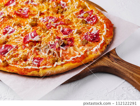 Pepperoni pizza with sausage on wood background 112122291