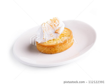 Lemon tartlet with meringue on plate 112122391