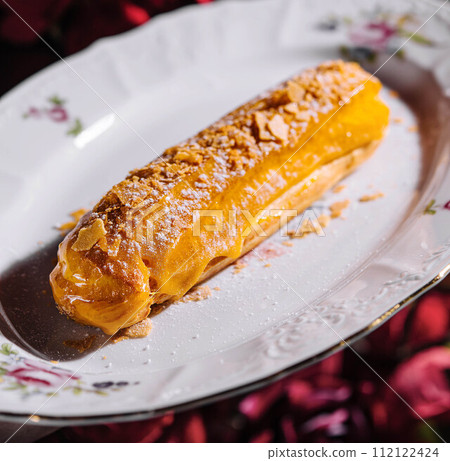 French Artisan Eclair on plate top view 112122424