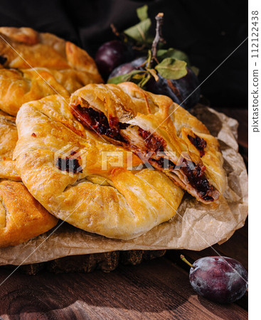 Delicious fresh sweet vertuta with plums Delicious fresh sweet vertuta with plums 112122438