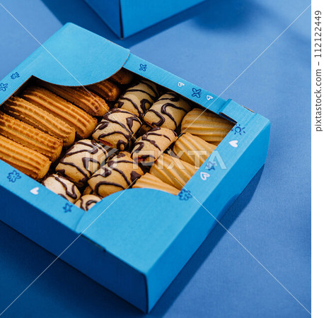 crumbly cookies in blue boxes 112122449