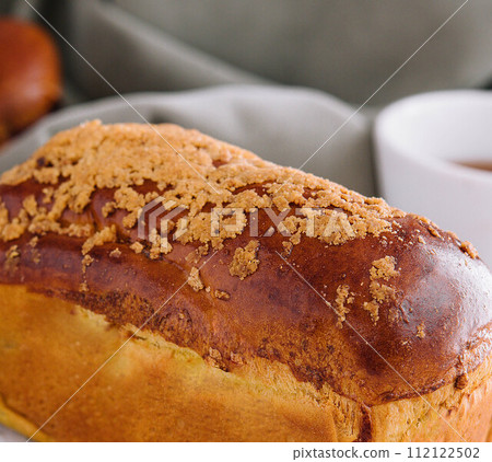 Delicious baked bun close up Delicious baked bun close up 112122502
