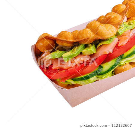 Belgian waffles with salmon, avocado and salad on box Belgian waffles with salmon, avocado and salad on box 112122607