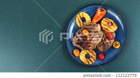 Grilled meat steak with pineapple. 112122778
