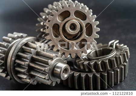 Gear and cogs wheels, clock mechanism, brass metal engine industrial. 112122810