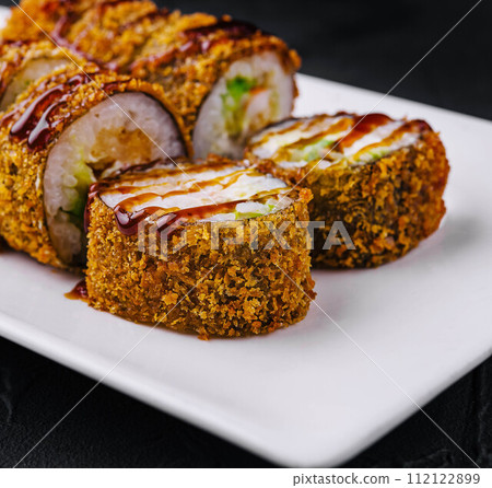 Tempura Maki Sushi on white plate Tempura Maki Sushi on white plate 112122899