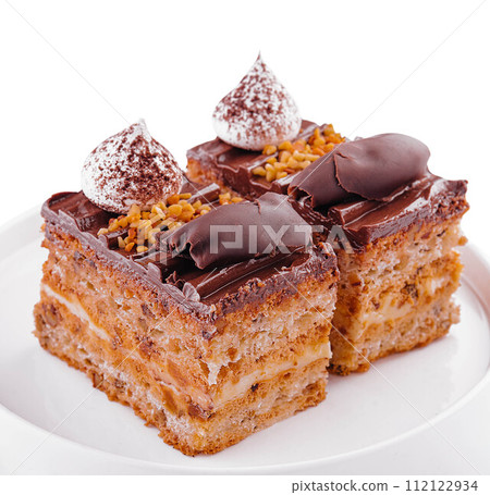 Chocolate cake on a white plate Chocolate cake on a white plate 112122934