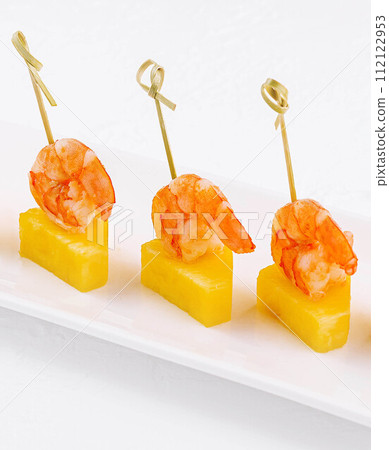 Canapes with shrimp and pineapple on plate Canapes with shrimp and pineapple on plate 112122953