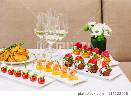 table with different gourmet snacks for white wine table with different gourmet snacks for white wine 112122956