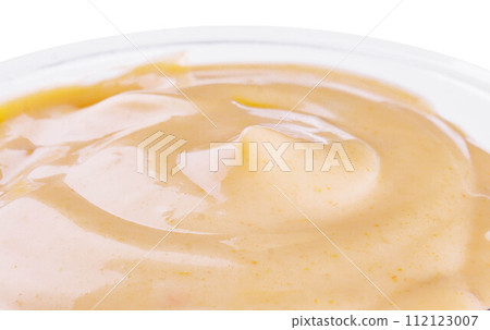 Small pot of garlic mayonnaise close up 112123007