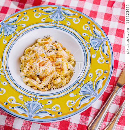Penne Pasta with Parmesan with olives and olives on the table 112123453