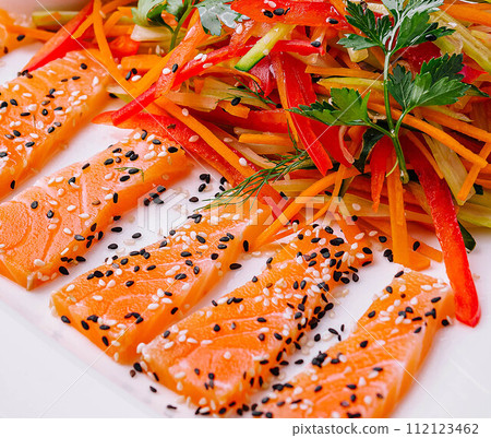 Salmon Slices with Carrot and Pepper Salad and Soy Sauce - Asian Cuisine 112123462