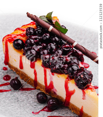 Classic New York style cheesecake with currant jam 112123539
