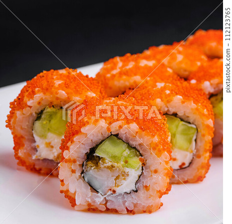 Macro shot of california maki sushi rolls with rice 112123765