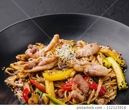 Chinese fried rice with vegetables on black plate Chinese fried rice with vegetables on black plate 112123918