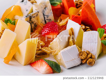 Cheese plate with different types of cheese Cheese plate with different types of cheese 112123948
