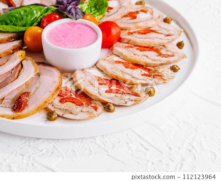 sliced meatloaf with peppers and capers sliced meatloaf with peppers and capers 112123964