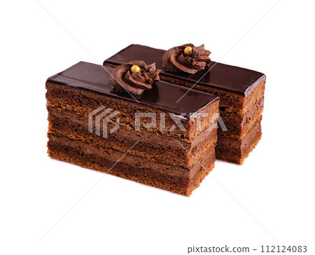 Close up of two pieces of chocolate cake on white 112124083
