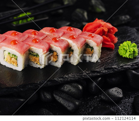 Japaneese food, tuna sushi rolls on stone board Japaneese food, tuna sushi rolls on stone board 112124114