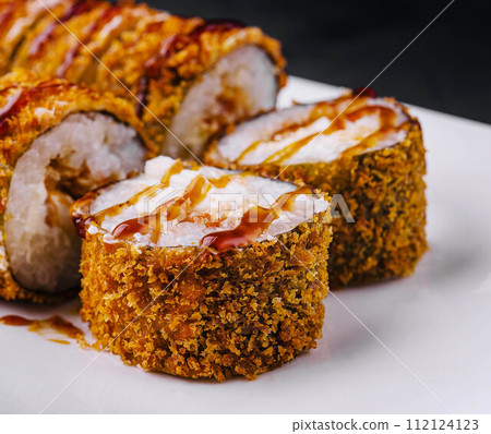 Warm tempura sushi rolls close up 112124123