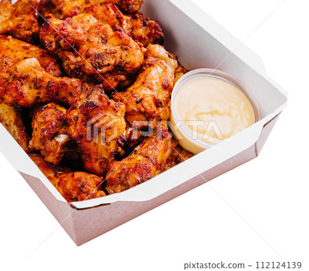 Fried chicken wings and legs in a paper box 112124139