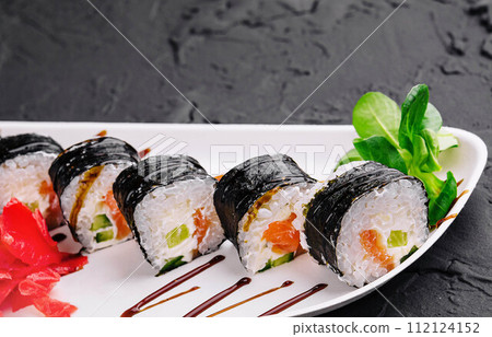 nori sushi rolls with salmon on plate 112124152