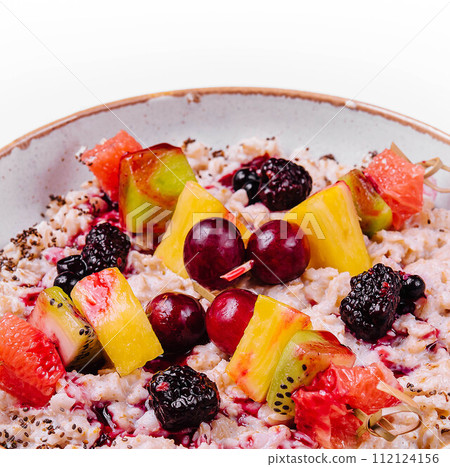 porridge with fruits on bowl isolated 112124156