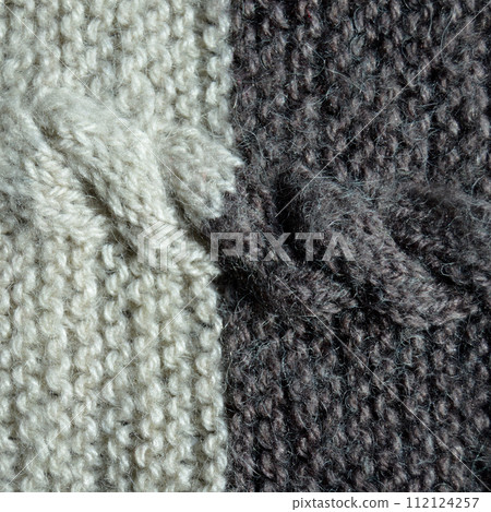 Handmade knitted fabric grey white wool background texture 112124257