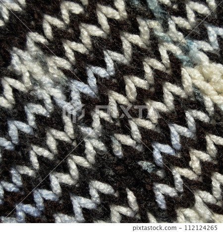 Handmade knitted fabric white brown wool background texture Handmade knitted fabric white brown wool background texture 112124265