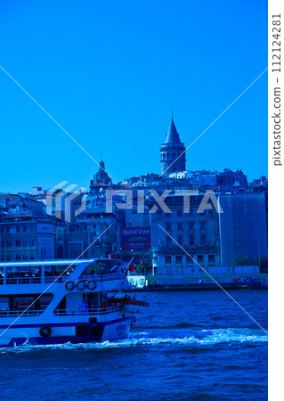 Galata Bridge and Galata Tower, one of the most visited places in Istanbul and small cruise ship, June 22 2019 Karakoy Istanbul Turkey 112124281