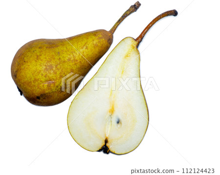 A pear cut in half. The pulp of a juicy fruit. Yellow pear on a white background. Food for a raw food lover. Delicious snack. 112124423