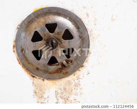 Rusty drain overflowing for the bathroom. Mold on bathroom faucet. Old plumbing. Requires replacement. 112124456