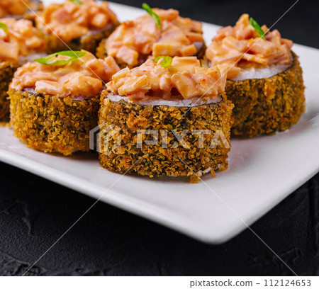 Hot fried sushi roll on white plate 112124653